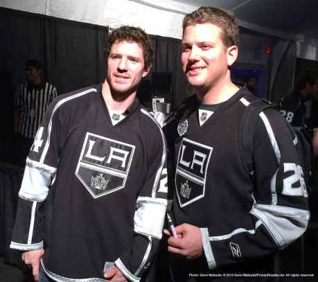 Center Colin Fraser (left) with a fan